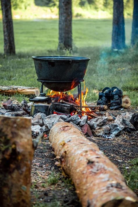 A Cauldron for Cooking is on the Fire Stock Image - Image of summer ...