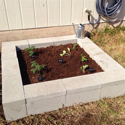 DIY Cinder Block Raised Garden Bed. Visit www.fabeveryday.com for ...