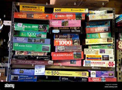 Stacks of used jigsaw puzzles for sale in the Pixie Woods Antique Shop. Battle Lake Minnesota MN ...