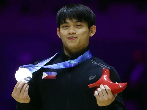 Philippines’ Carlos Yulo wins the men's vault silver medal in the 2022 ...