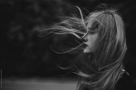 "Portrait Of A Young Woman With Hair Blowing In The Wind" by Stocksy ...