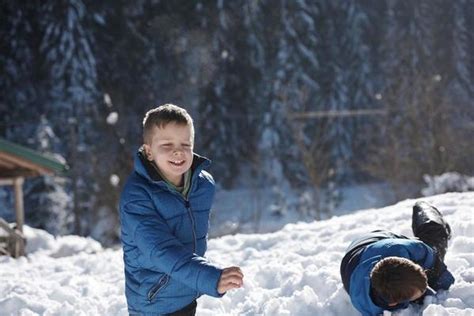 Kids Playing With Snow Stock Photos, Images and Backgrounds for Free ...