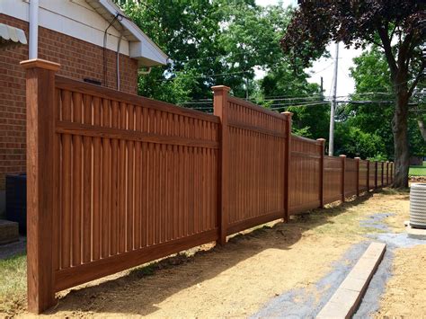 Vinyl cedar grain semi- privacy fence with 5', 6', and 4' sections. | Fence, Fencing companies ...