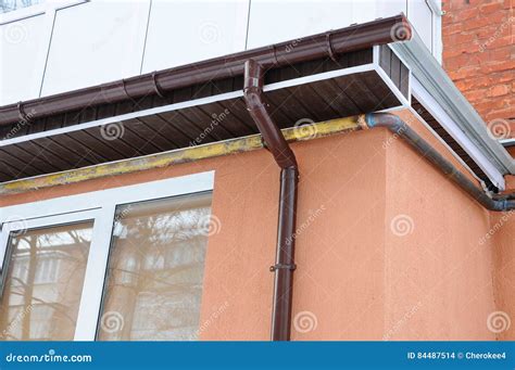 Rain Gutter On The Roof Of The Balcony. New Gutters For Water Drainage ...