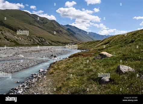 mountain valley mountain river Stock Photo - Alamy