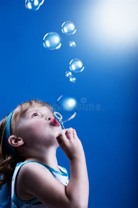 Bubbles. A little girl blowing soap bubbles , #Ad, #girl, #Bubbles, #blowing, #bubbles, #soap # ...