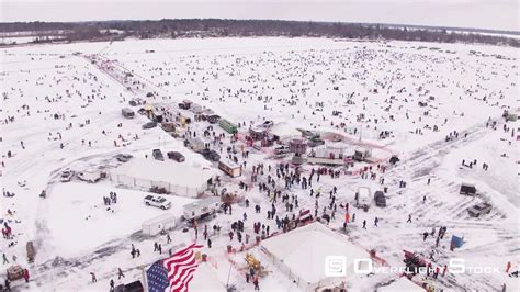 OverflightStock™ | Brainerd Ice Fishing Extravaganza Minnesota Aerial Stock Footage