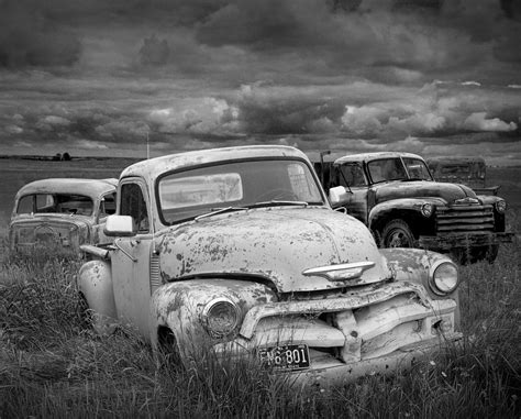 Black And White Photograph Of A Junk Yard With Vintage Auto Bodies ...