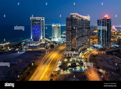 Doha Skyline, Curve and Hilton Hotel in Qatar Stock Photo - Alamy