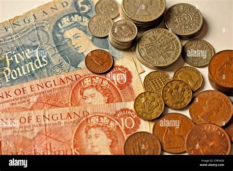 Old English banknotes and coins Stock Photo - Alamy