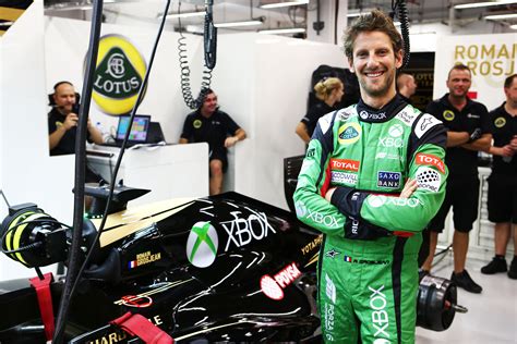 The Lotus F1 drivers wore green XBOX overalls over the Singapore GP ...