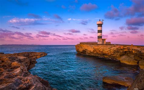 Download wallpaper 2560x1600 lighthouse, bay, sea, rocks, sunrise, spain widescreen 16:10 hd ...