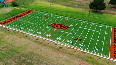 Sooner fan paints Oklahoma State football field in backyard after bet