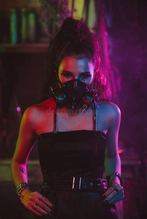 Cyberpunk Cosplay. a Girl in a Gas Mask in a Post-apocalyptic Style with Neon Lighting Stock ...