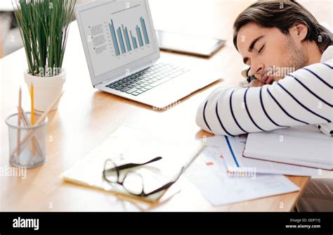 Pleasant man sleeping in the office Stock Photo - Alamy