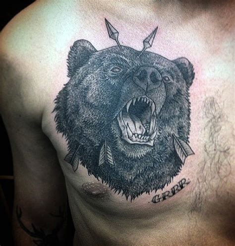 Unusual painted black ink roaring bear with arrows in head and lettering tattoo on chest ...