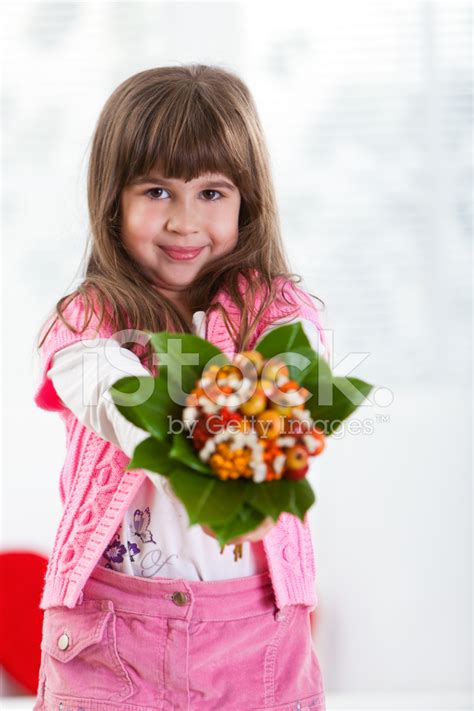 Little Girl Giving Flowers Stock Photo | Royalty-Free | FreeImages