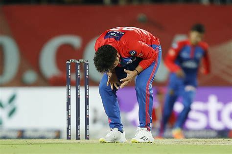 Kuldeep Yadav reacts after the second catch was dropped off his bowling ...