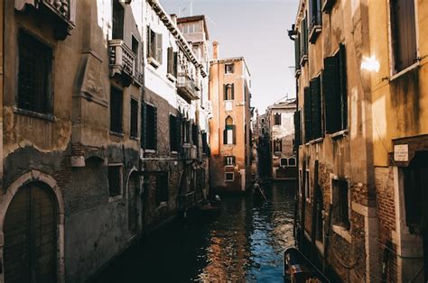 Premium Photo | Scenic canal with ancient buildings in venice, italy