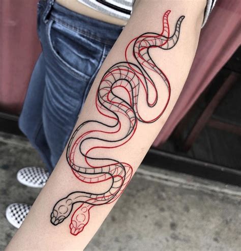 a woman with a tattoo on her arm has a red and black snake on it