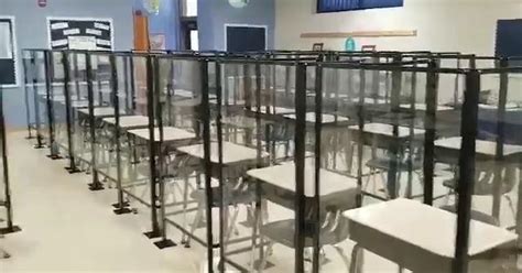 View of 28-desk classroom with plexiglass barriers in an Horry County Schools elementary ...