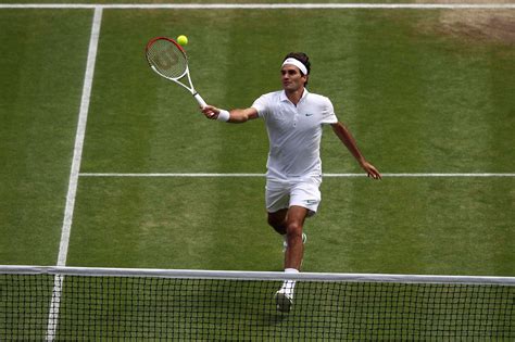 Roger Federer hits a forehand volley against Mikhail Youzhny during ...