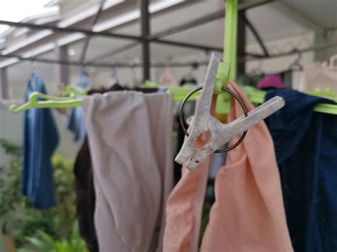 Premium Photo | Metallic or plastic hangers and clips use to dry clothes outdoor at the open ...