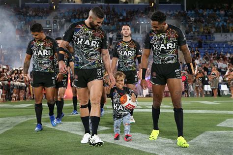 Quaden Bayles smiles wide as he leads out all-star rugby team in front of thousands