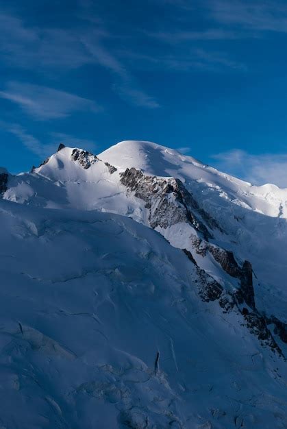 Premium Photo | View on snowy mountain top in alps