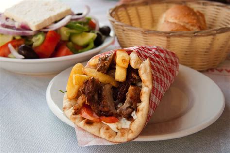 Traditional Greek souvlaki with salad | Greek recipes, Greece food, Food guide