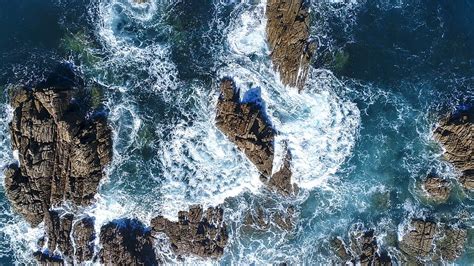 HD wallpaper: ocean waves hammering stone formation, aerial photography of ocean wave crashing ...