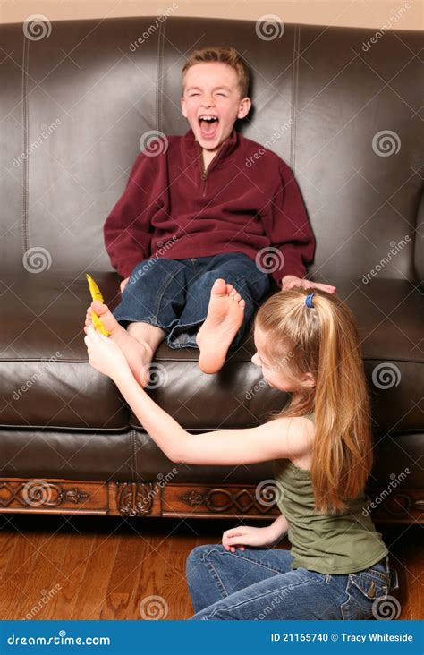 Children Tickling Feet With Feather Stock Photo - Image of love, color ...