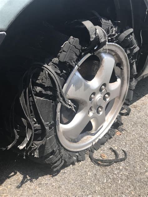 Car tire after running over a spike strip : r/mildlyinteresting