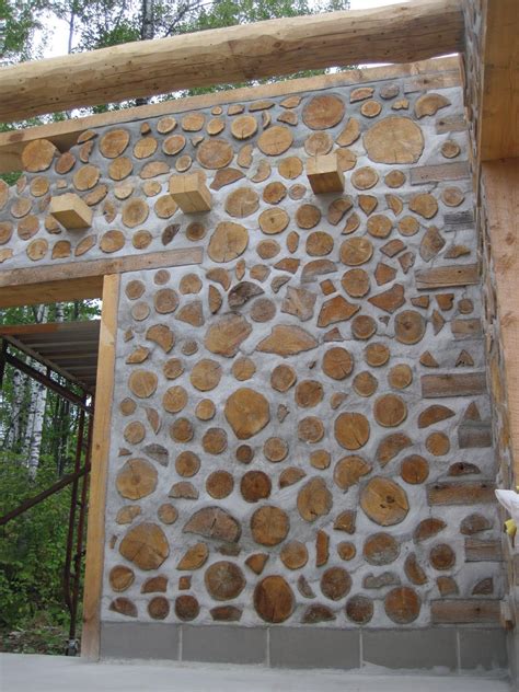 Cordwood wall with logs. Note beams sticking out can be a shelf on the ...