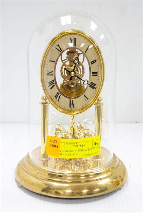 VINTAGE MECHANICAL PERPETUAL MOTION CLOCK