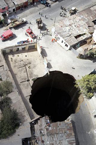 Giant hole swallows homes in Guatemala