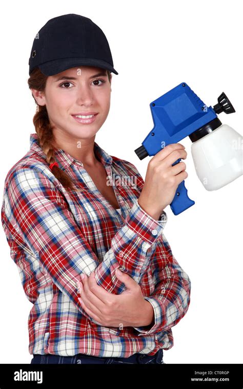 Woman holding a spray gun Stock Photo - Alamy