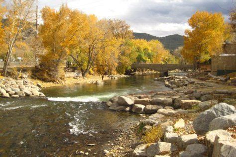 Arkansas River flows through Salida, Colorado with fall colors. Iron ...