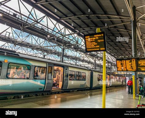 Leeds city train station platform 16A Stock Photo - Alamy