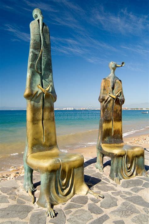 Malecon Statues. A pair of the many unique statues situated along the ...