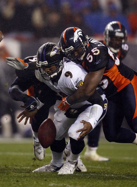 Steve McNair #9 of the Baltimore Ravens is sacked and fumbles – Denver Broncos History