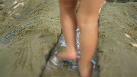 Child Walking Barefoot Outside Water Mud Stock Footage Video (100% ...