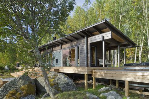 Nordic Minimalism: Wilderness Sauna Cabin in Finland with Outdoor Terrace