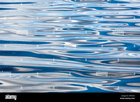 reflections on water surface Stock Photo - Alamy