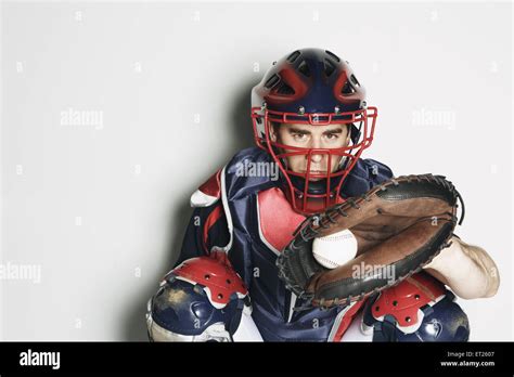 Baseball catcher against white background Stock Photo - Alamy