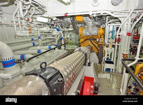 Engine room on a cargo boat ship Stock Photo - Alamy