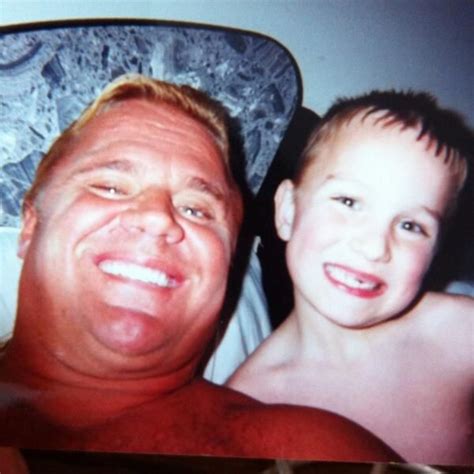 Classic photo of WWE Hall of Fame legend "Mr. Perfect" Curt Hennig and his youngest son Hank ...