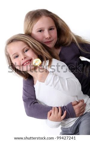 Two Sisters Hugging. Stock Photo 99427241 : Shutterstock