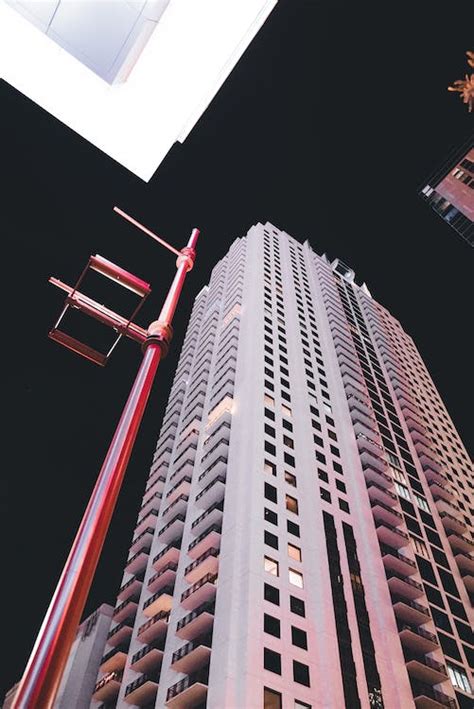 Modern Skyscraper against Night Sky · Free Stock Photo