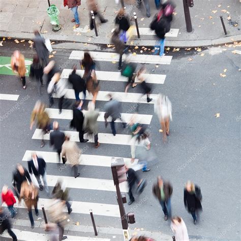 Crowd aerial view | Aerial view of a crowd of people crossing a city street at a pedestrian ...